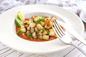 Stewed kohlrabi cabbage with lime and tomato sause
