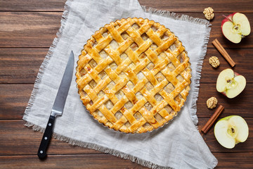 Apple pie traditional dessert for Independence Day in America. Delicious tart with nuts and raisins. Flat lay.