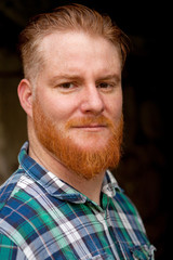 Fototapeta premium Portrait of red haired man with long beard