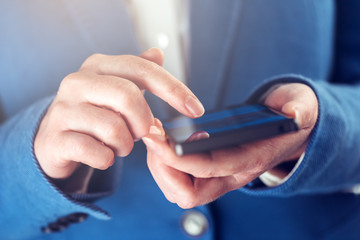 Female hands with mobile phone