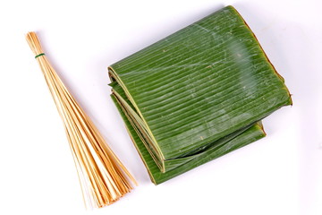 Thai wrap dessert cooking as banana leaf and thin bamboo.