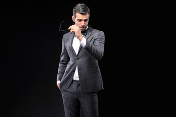 young business man posing with gray suit and bow tie