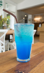 Blue italian soda on wood table
