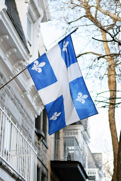 Quebec Flag In Montreal Billowing In The Breeze