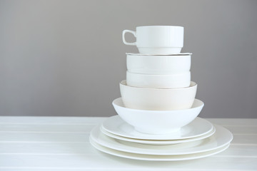 Minimalist picture of white porcelain kitchenware piled up