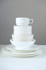 Minimalist picture of white porcelain kitchenware piled up