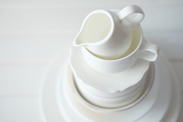 Minimalist picture of white porcelain kitchenware piled up