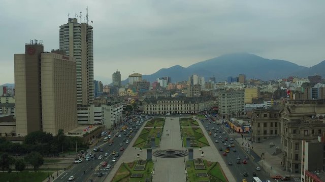 Lima Peru Aerial v54 Flying low over park plaza and traffic panning with cityscape views.