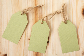 Blank price tags on a wooden background