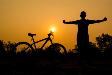 Fototapeta na wymiar Silhouettes of mountain bike with man in action something