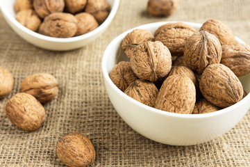 Walnuts close-up on a rustic background of burlap