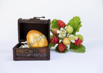 Gold Easter egg design in vintage wooden box