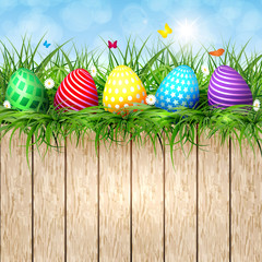 Golden Easter eggs on a wooden background