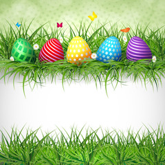 Golden Easter eggs on the grass