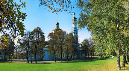 Naklejka premium Blue Orthodox Church with a green lawn in summer