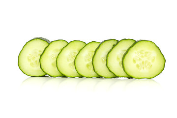 Cucumber slices over a white background.