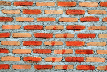 White-brown wall from bricks for background.