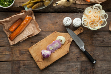 Sliced onion prepared for cooking dinner with smoked salmon and potatoes. Ingredients for making favorite russian food.