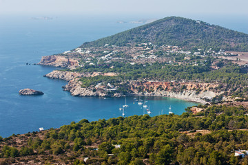 Fototapeta na wymiar Aerial view of Ibiza. Beautiful turquoise bay at Ibiza. Luxury rest at Balearic Islands.