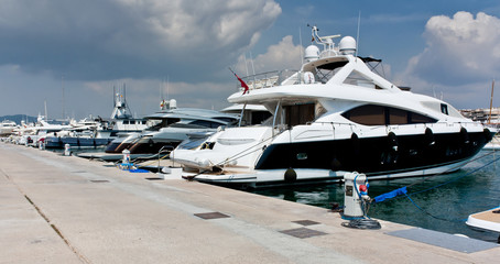 Yacht at the pier, Ibiza. Luxury rest at Balearic Islands. Holidays of rich people. Yacht rental.