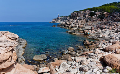 Fototapeta na wymiar Wild stone beach at Ibiza north.