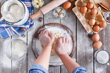 Making dough top view on rustic wood background