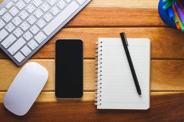 Office desk wood with computer, note book,phone concept in wood background.Copy space.