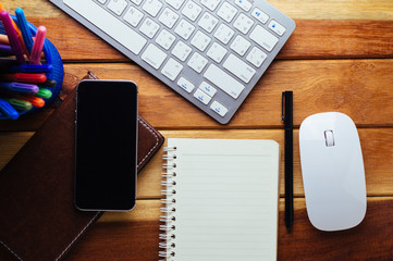 Office desk wood with computer, note book,phone concept in wood background.Copy space.