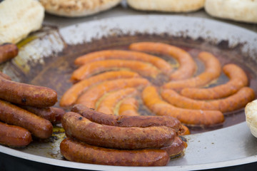 Home made smoked sausage that is fried in fat