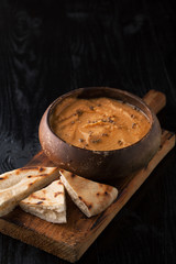 Hummus and pita bread and spices