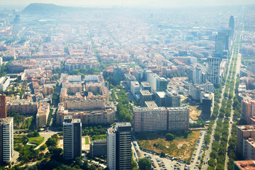 Fototapeta na wymiar Modern neighbourhoods of Barcelona in Spain, aerial view