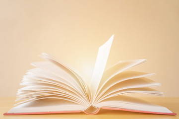 Vintage old books on wooden deck table and grunge background