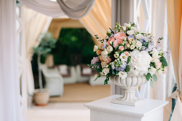 Beautiful wedding bouquet in stone vase, closeup