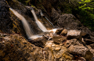 Little waterfall in autumn scenery. Tatra Mountains, Poland