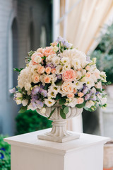 Beautiful wedding bouquet in stone vase, closeup