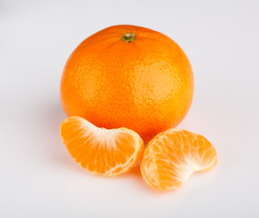 Ripe mandarin close-up on a white background. Tangerine orange. Colorful Food and drink still life concept. Fresh fruits and vegetables on color background. Clementine. Citrus. Fresh fruits. Diet.