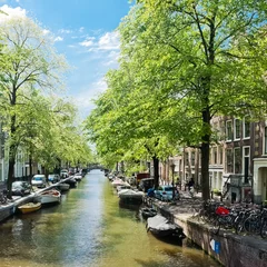 Deurstickers Amsterdam with green canal in the downtown, Holland © Valeri Luzina