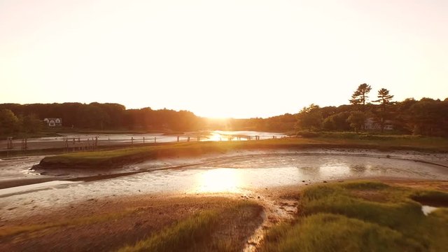 Maine Aerial Estuaries v22 Flying low over estuary inland at sunset.
