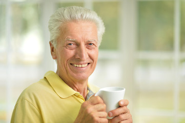 senior man drinking coffee