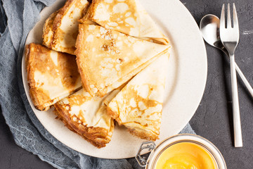 Pancakes with pumpkin cream and homemade peanut butter, horizontal, soft focus
