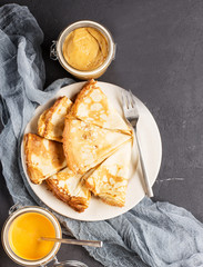 Pancakes with pumpkin cream and homemade peanut butter, vertical, soft focus   © giftulya