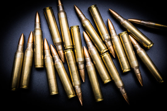 Rifle cartridges 5.56 mm on black background