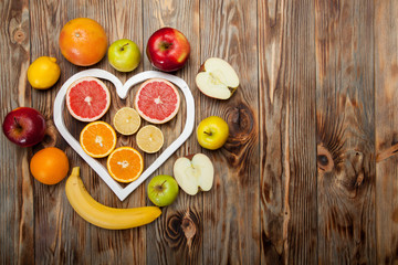 Fruits heart on the wooden background
