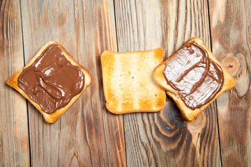toast and chocolate on wooden table