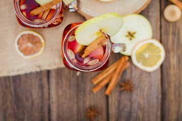 Mulled wine in glass mug   with spices and citrus fruit
