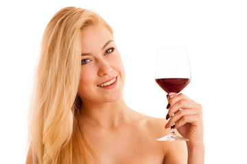 Cute blonde woman drinks a glass of red wine isolated over white background