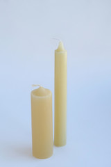 two simple wax candles on white abstract background. element for design