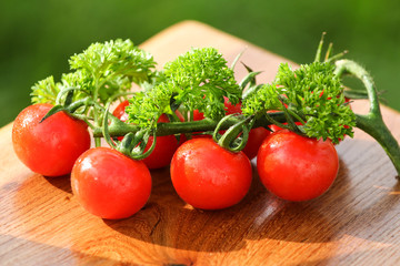 Fresh cherry tomatoes on wooden table
