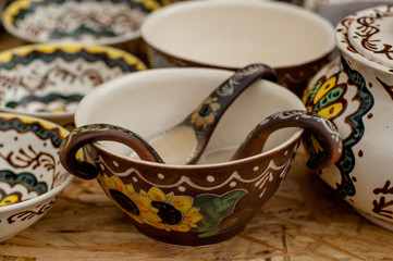 Close-up of a set of painted ceramic tableware