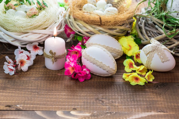 Fototapeta na wymiar Beautiful Easter eggs with flowers on the wooden background